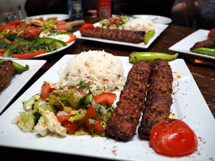 Adana kebab with rice and salad